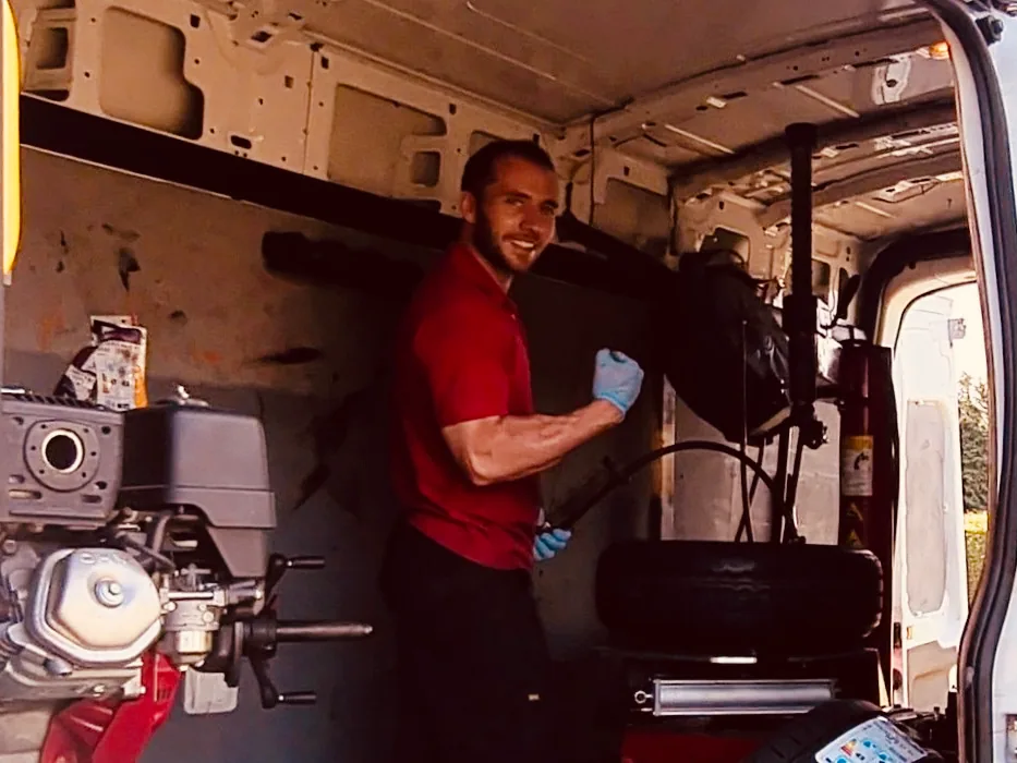 Dean Spicer working at the tyre changer inside his service van