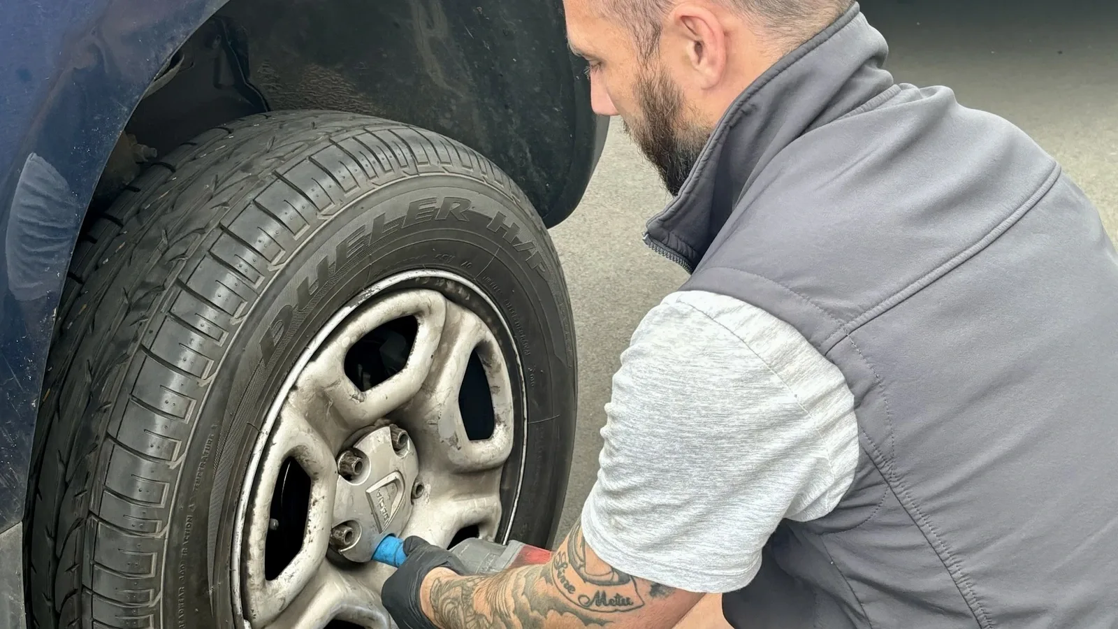 Dean Spicer fitting a tyre using a torque wrench on a customer's vehicle